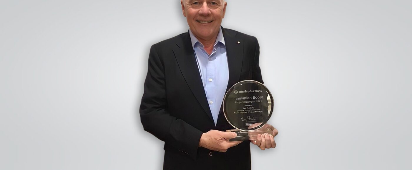 Joe English holding his award landscape