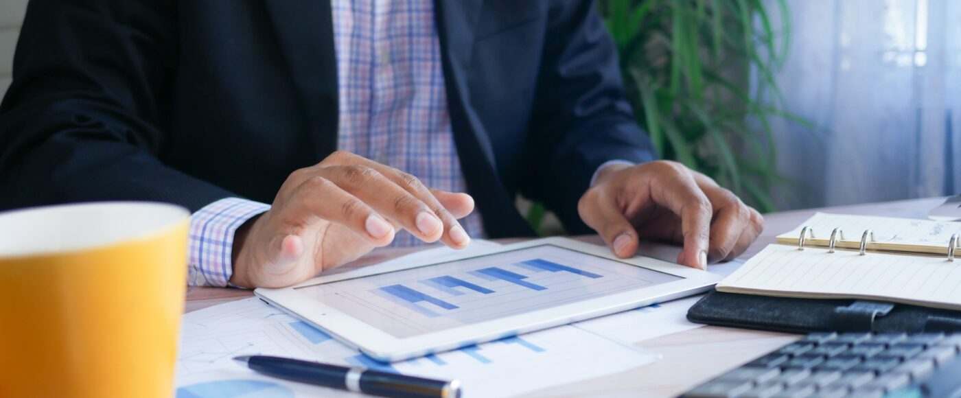 Business person looking at statistics on an ipad