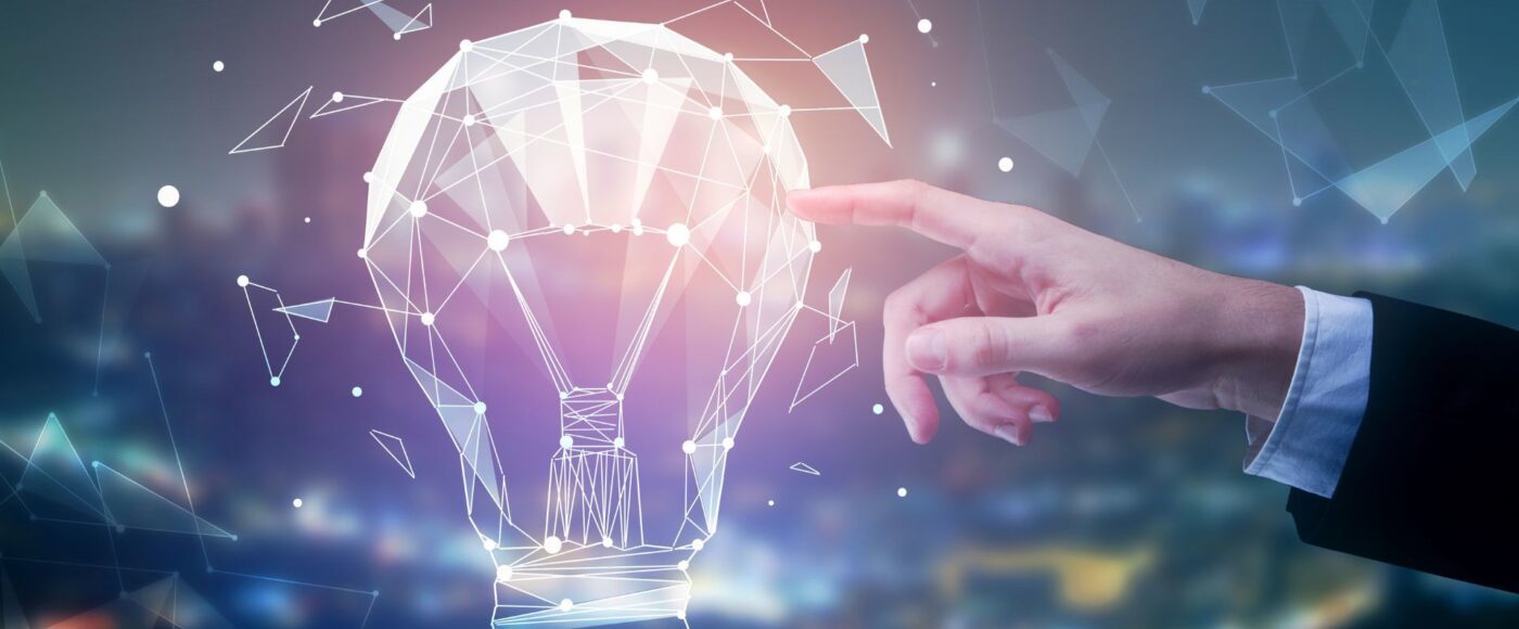 Digital image of hand touching a lightbulb