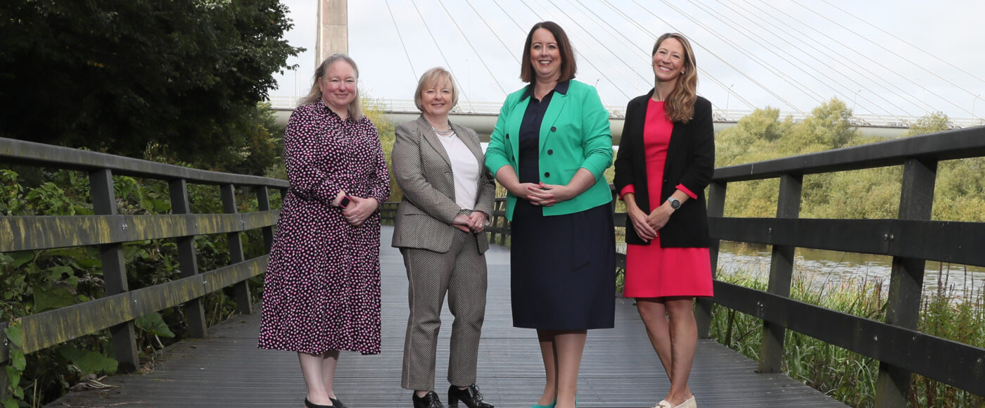 Four women standing in front of the Mary Mc Aleese Boyne Valley Bridge