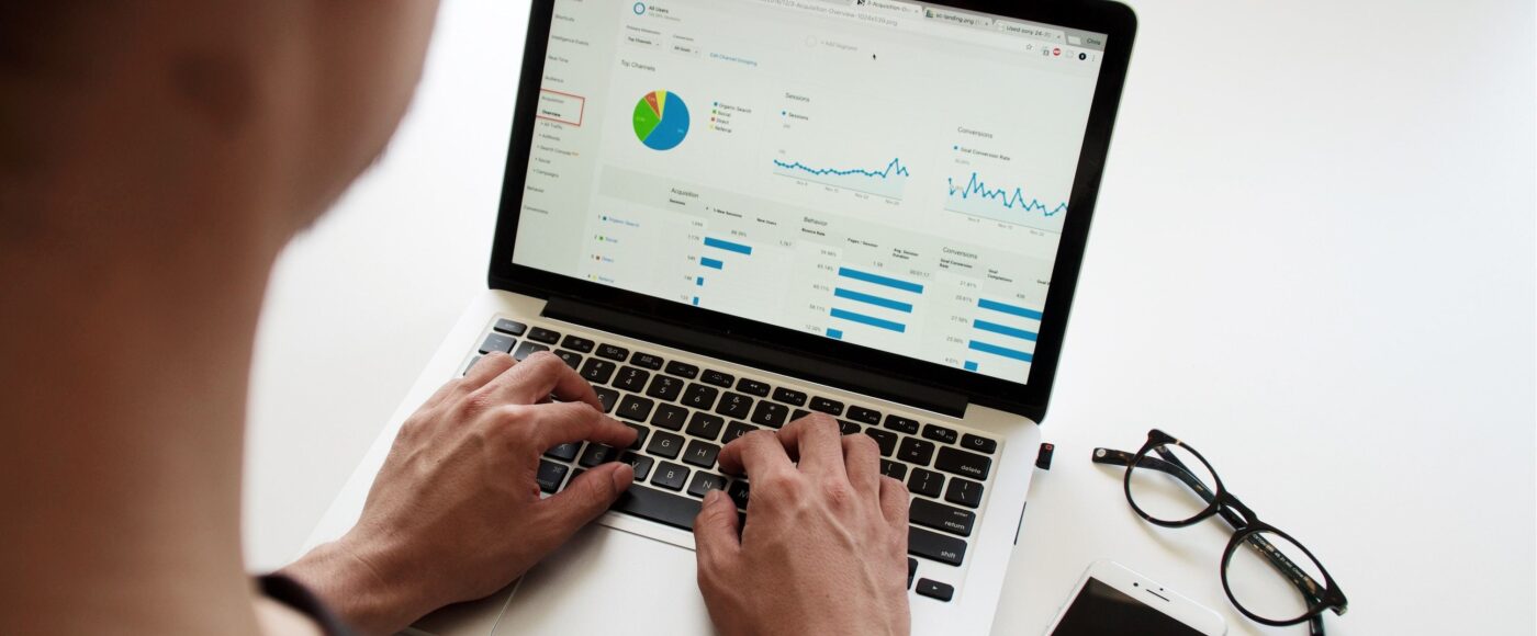 Man on his laptop looking at Google analytics