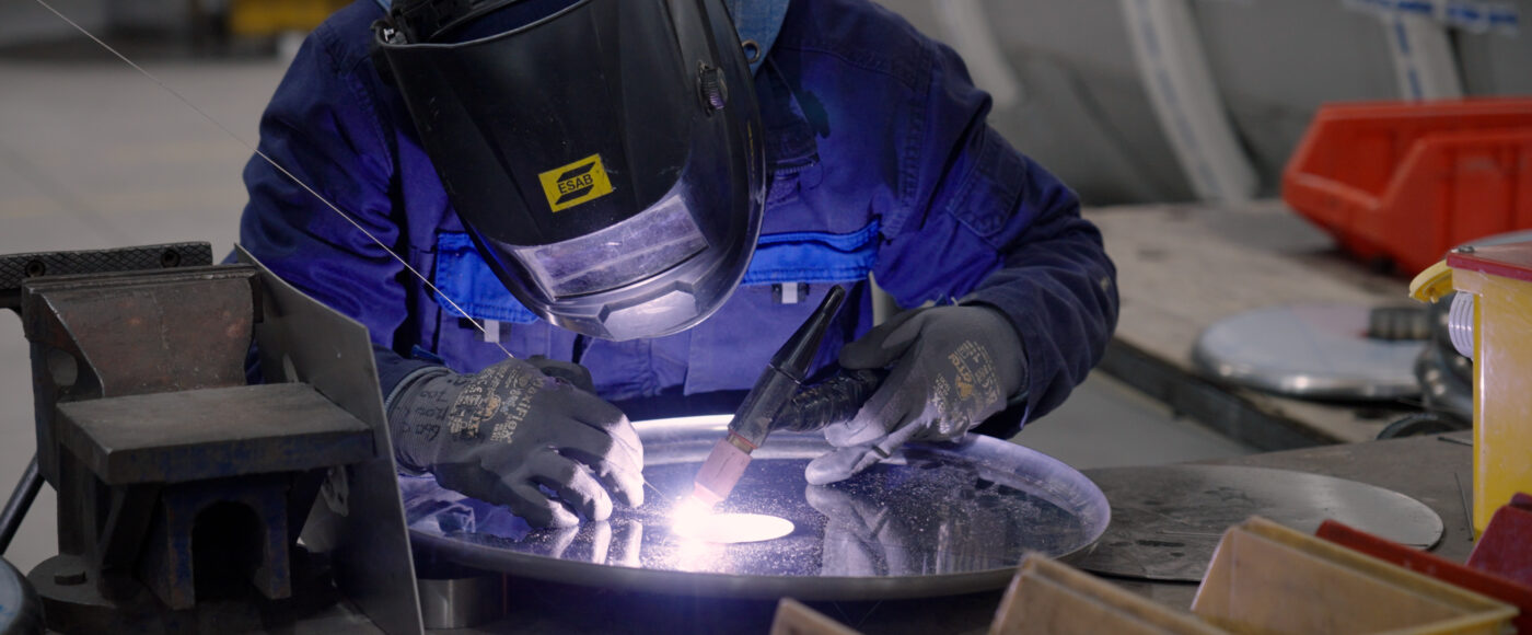 Welder in the Liscarroll warehouse